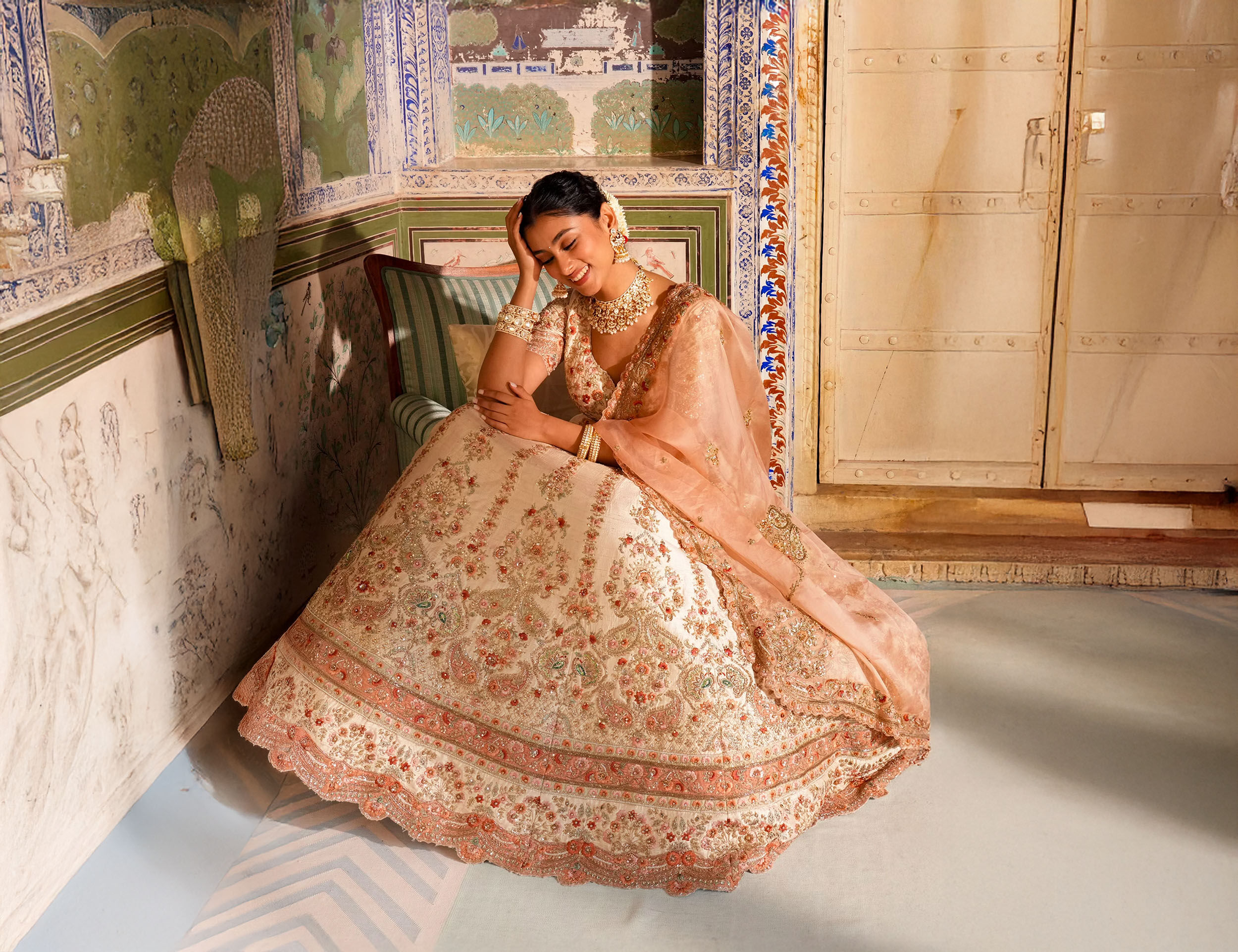 A lady posing in ivory white sequin lehenga